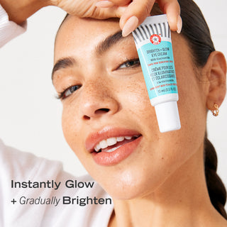 A woman holding Brighten + Glow Eye Cream with Niacinamide. Benefit: Instantly glow and gradually brighten.