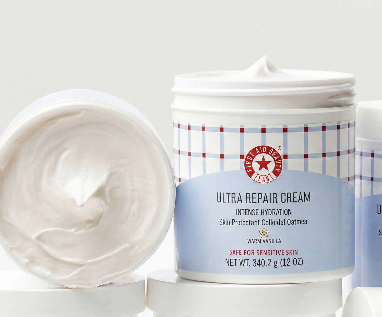 Ultra repair cream jar with visible cream on a white background